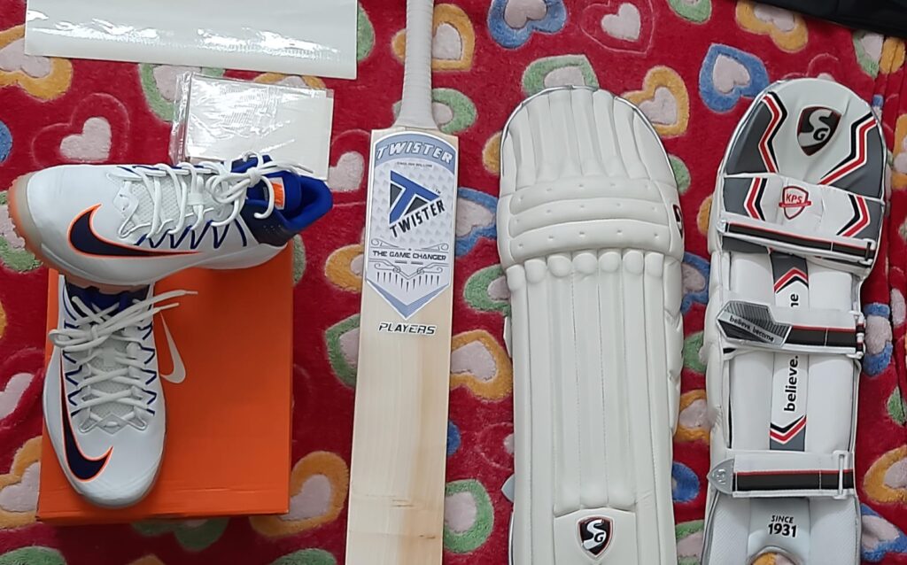 Cricket kit bag with batting pads, bat, and equipment - essential items checklist